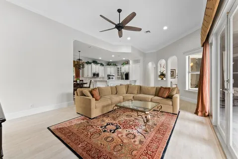 a kitchen with granite countertop a sink stainless steel appliances and cabinets