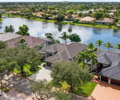 an aerial view of a house with a lake view