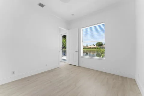 a view of backyard with swimming pool and outdoor seating