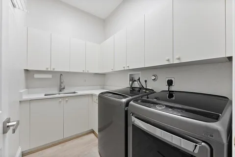 a view of a pathway with a wrought fence