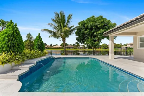 an aerial view of residential building and lake