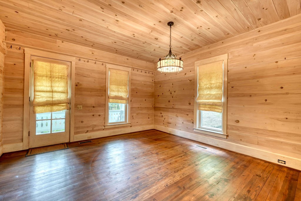 2350 Dial Road Blue Ridge, GA 30513 - Photo 27 of 76 a view of an empty room with a window and wooden floor