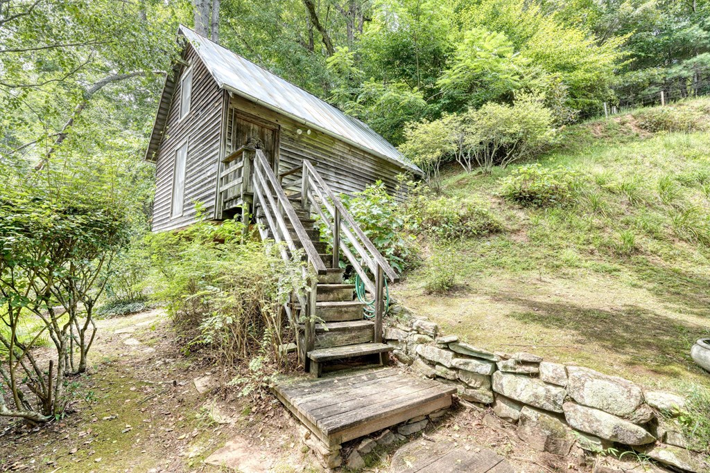 2350 Dial Road Blue Ridge, GA 30513 - Photo 40 of 76 a front view of a house with a yard
