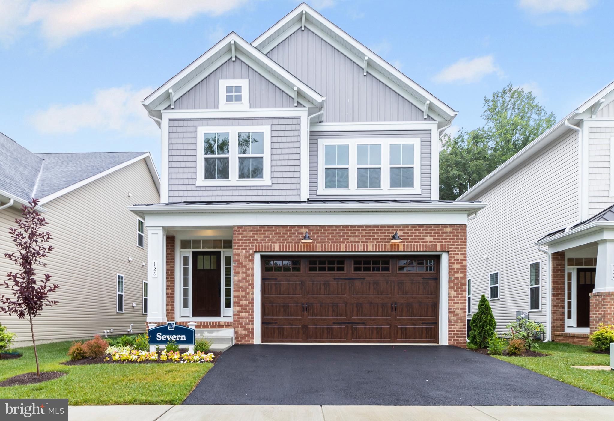 126 Sadie Way Arnold, MD 21012 - Photo 41 of 41 a front view of a house with a yard and garage
