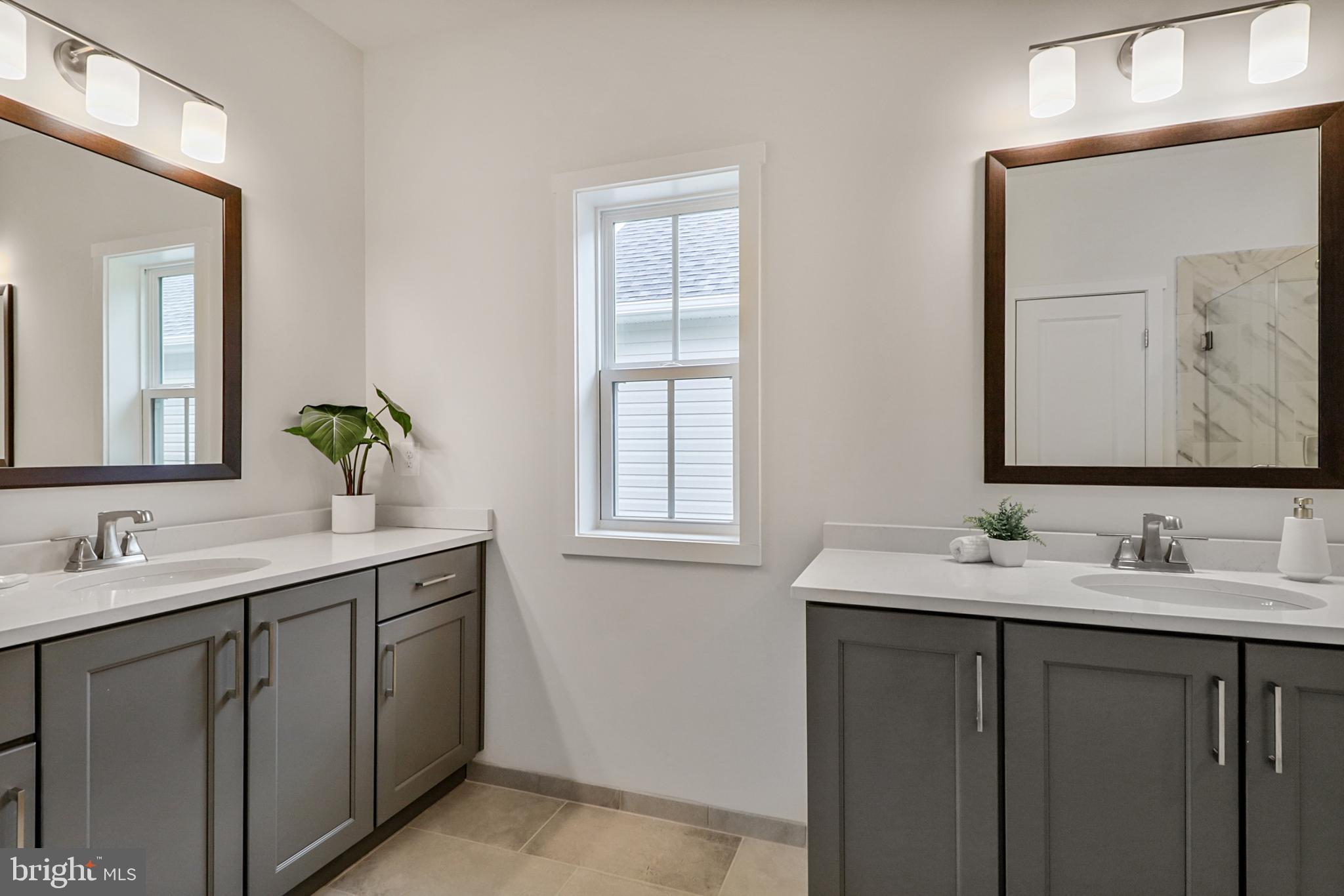 126 Sadie Way Arnold, MD 21012 - Photo 7 of 41 a bathroom with a double vanity sink and a mirror