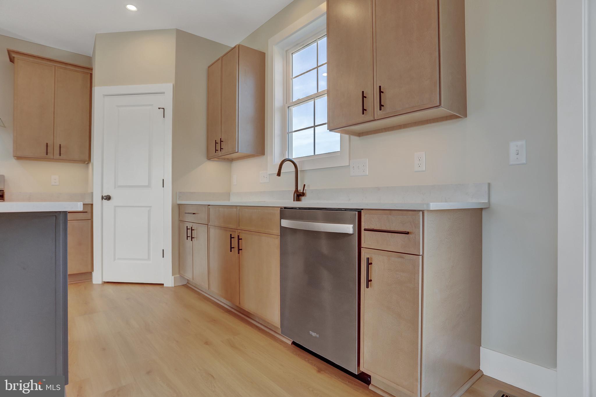 3542 Revolea Beach Road Middle River, MD 21220 - Photo 16 of 28 a kitchen with cabinets appliances and a sink