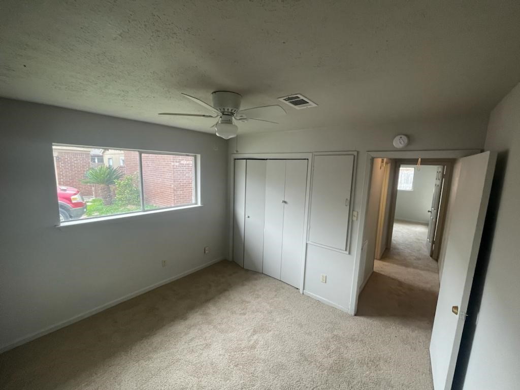 12779 Enchanted Path Drive Houston, TX 77044 - Photo 7 of 11 an empty room with windows and entrance