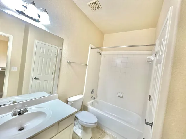 a bathroom with a toilet and a sink