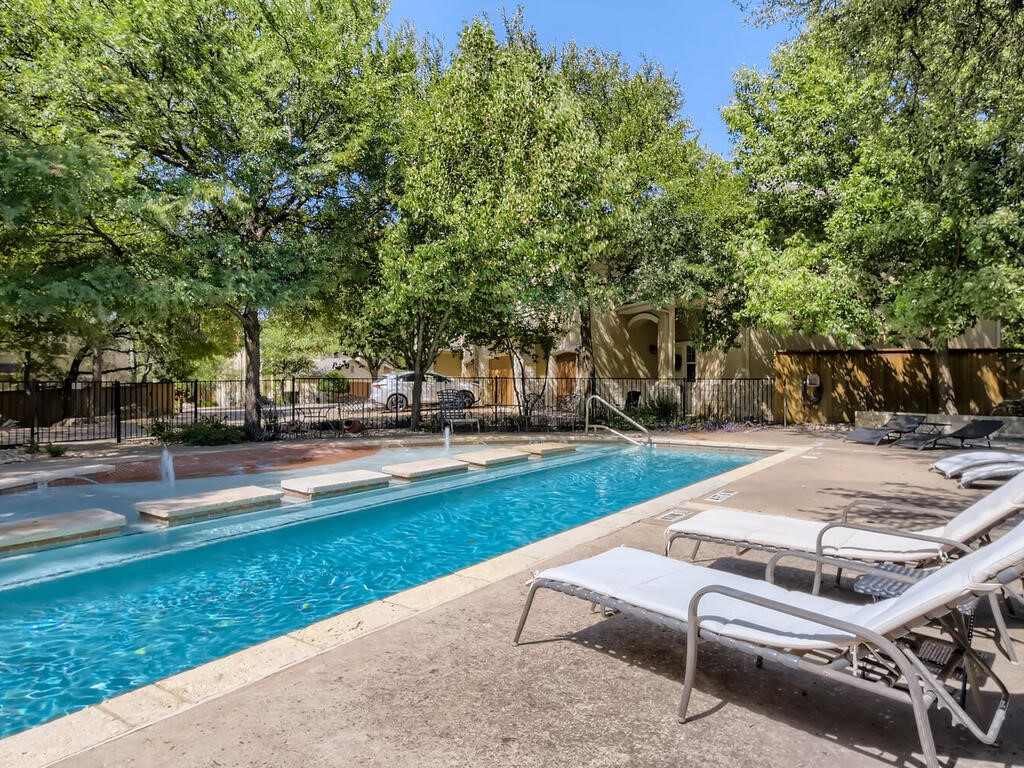 7708 San Felipe Boulevard, Unit 17 Austin, TX 78729 - Photo 10 of 10 a park view with large trees
