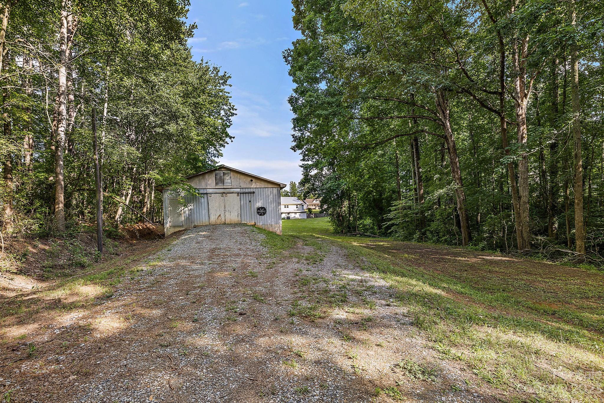 1353 Miles Road Dallas, NC 28034 - Photo 33 of 41 a view of a house with a yard