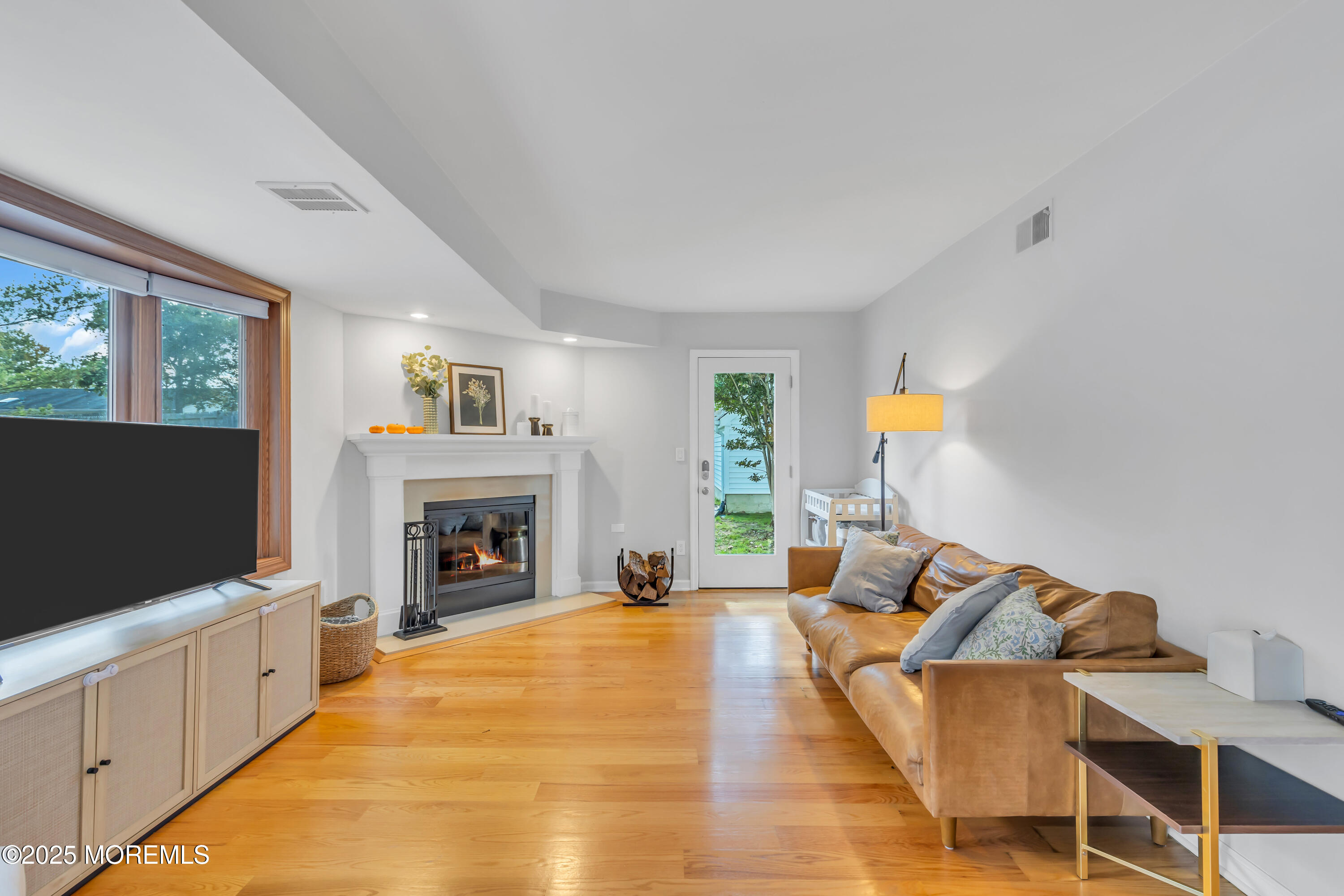 8 Allston Street Red Bank, NJ 07701 - Photo 14 of 64 a living room with furniture and a fireplace