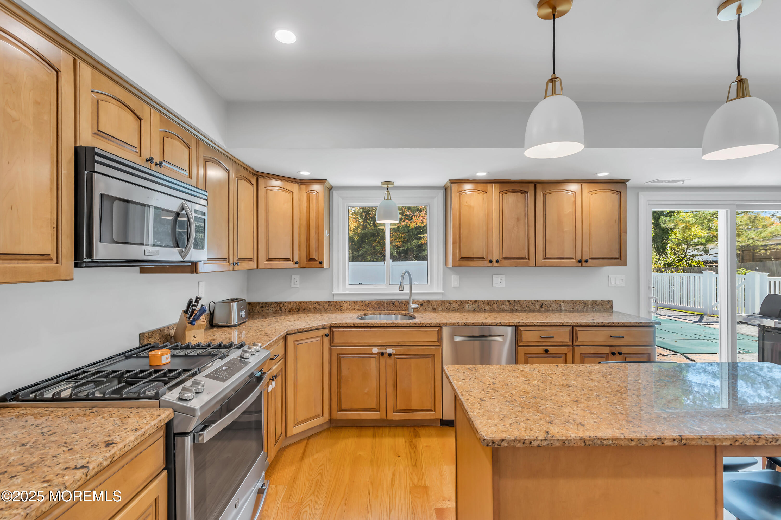 8 Allston Street Red Bank, NJ 07701 - Photo 23 of 64 a kitchen with a stove a sink a center island and windows