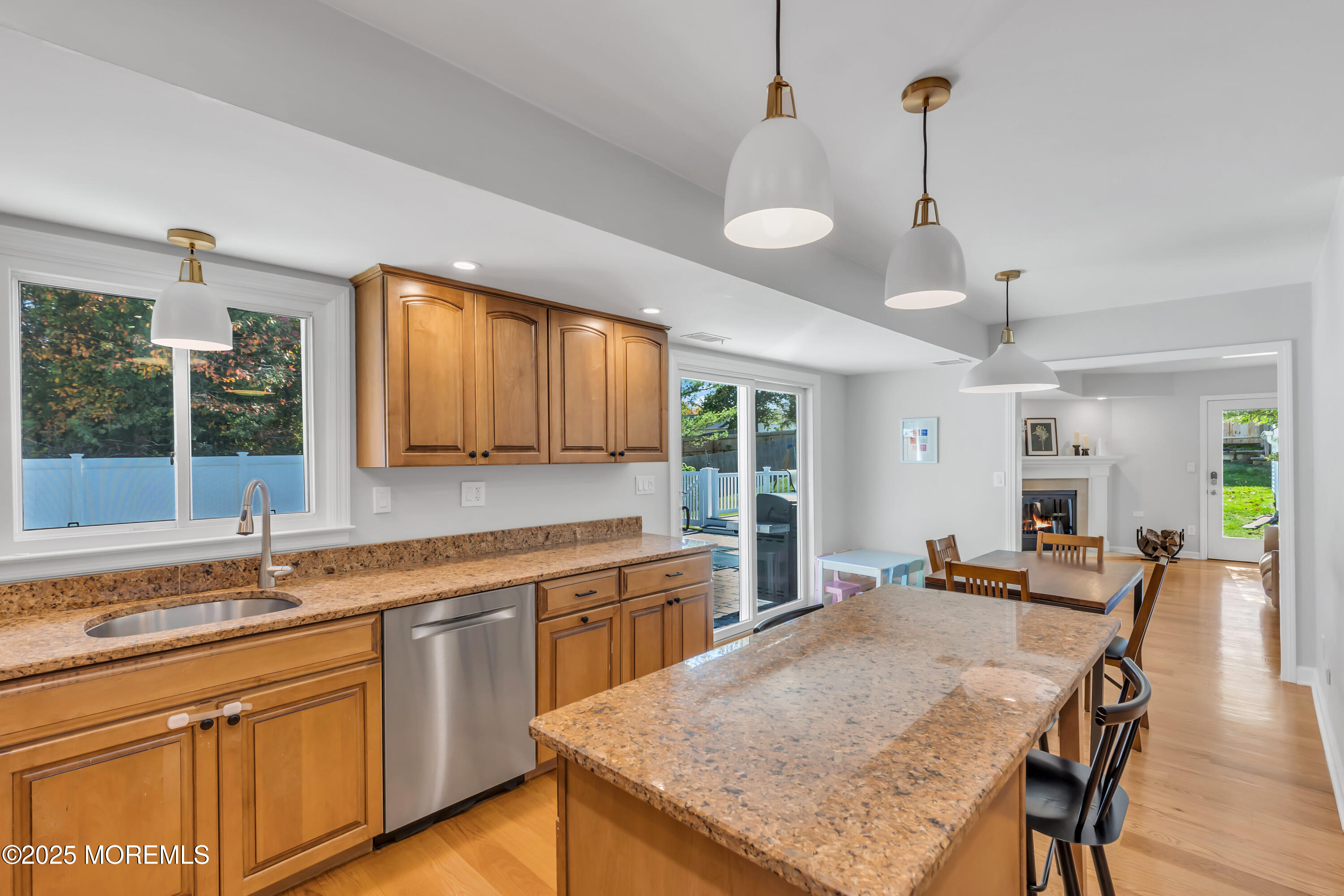 8 Allston Street Red Bank, NJ 07701 - Photo 24 of 64 a kitchen with a stove a sink a dining table and chairs