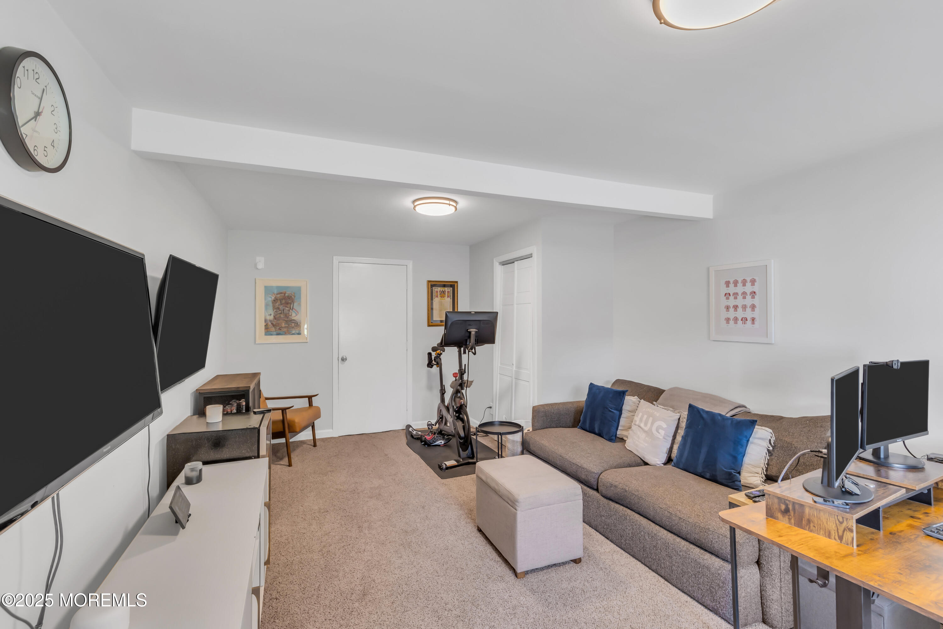 8 Allston Street Red Bank, NJ 07701 - Photo 28 of 64 a living room with furniture a flat screen tv and a window