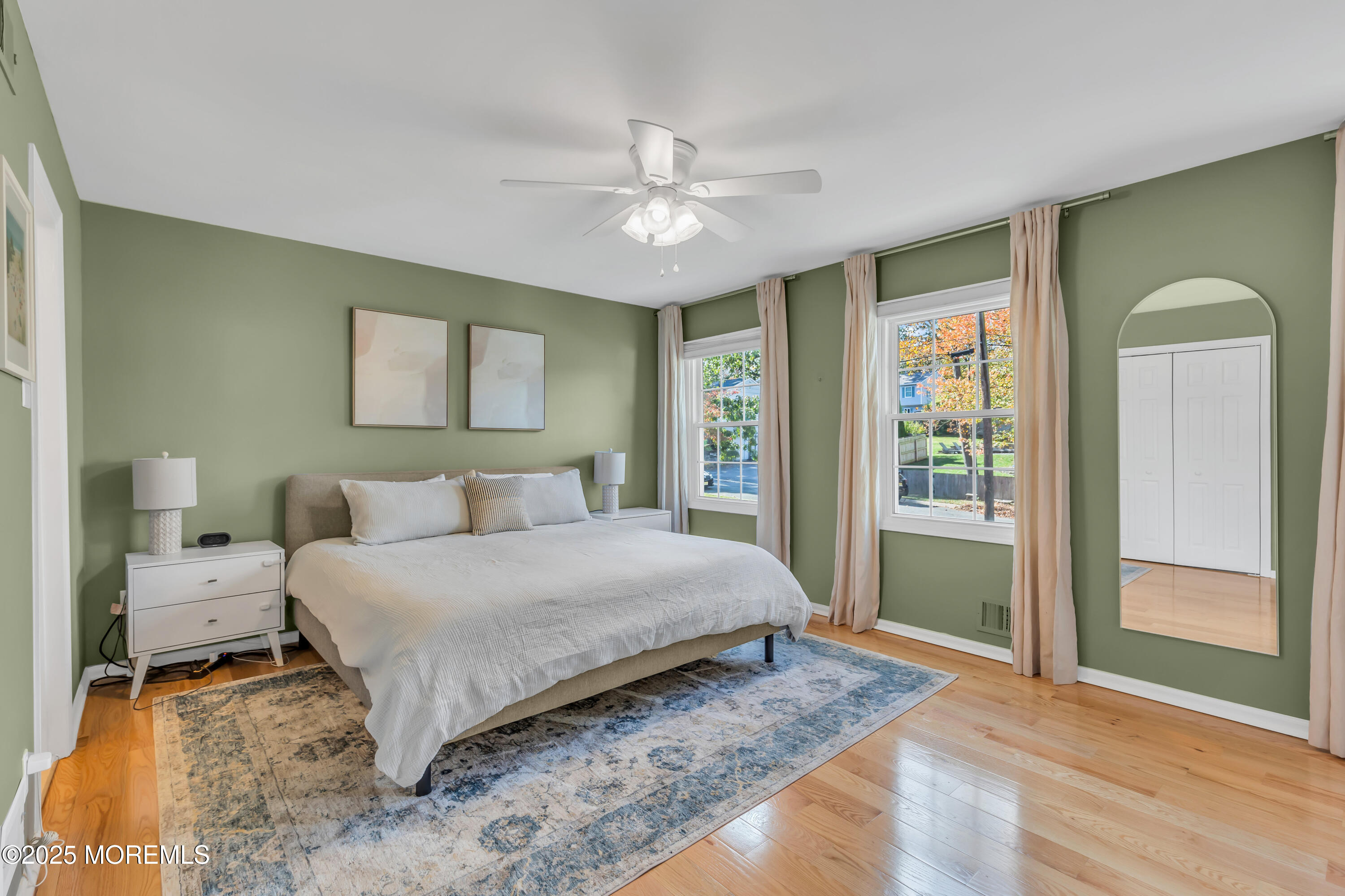 8 Allston Street Red Bank, NJ 07701 - Photo 41 of 64 a bedroom with a large bed and a chandelier