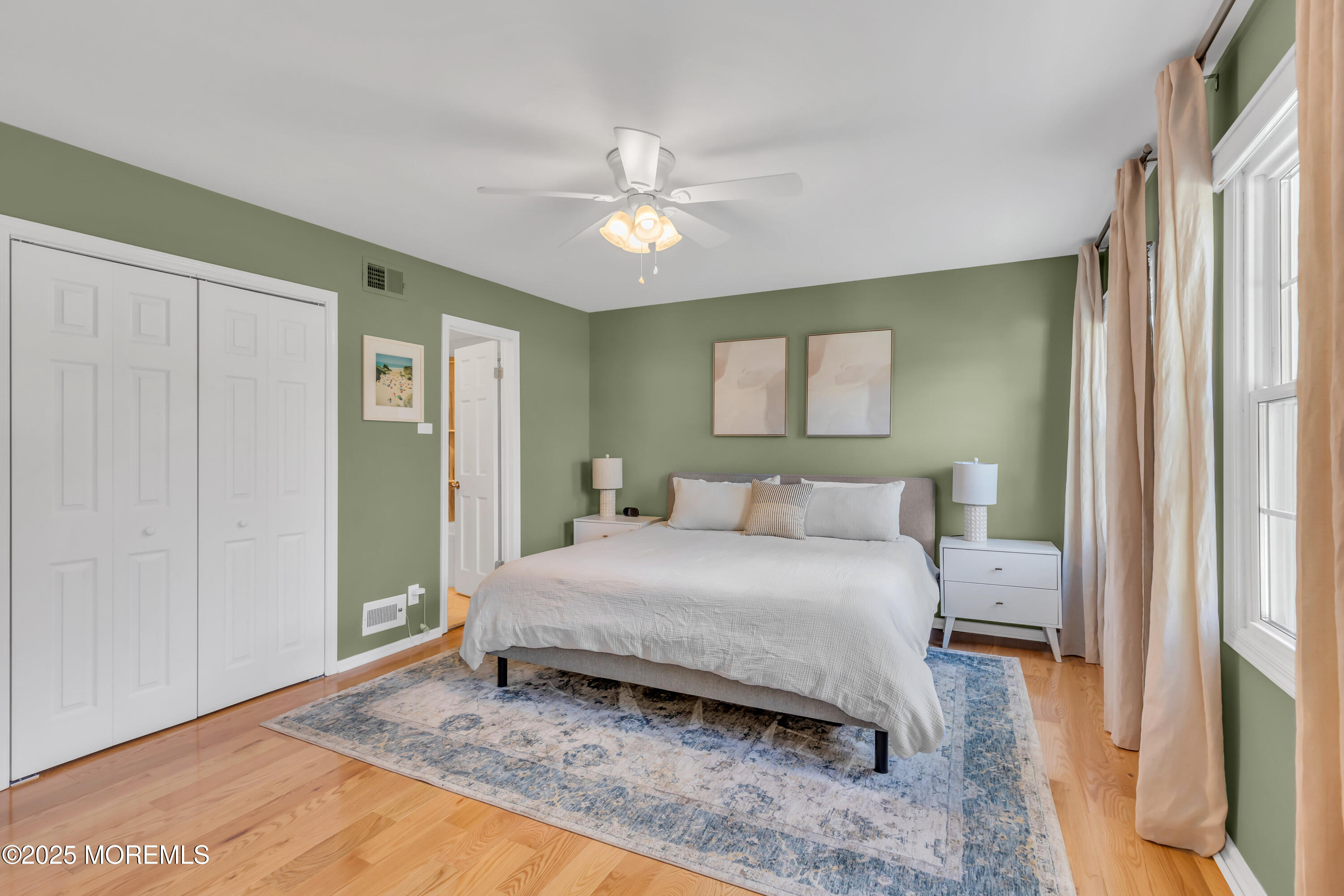 8 Allston Street Red Bank, NJ 07701 - Photo 42 of 64 a bedroom with a bed and a chandelier