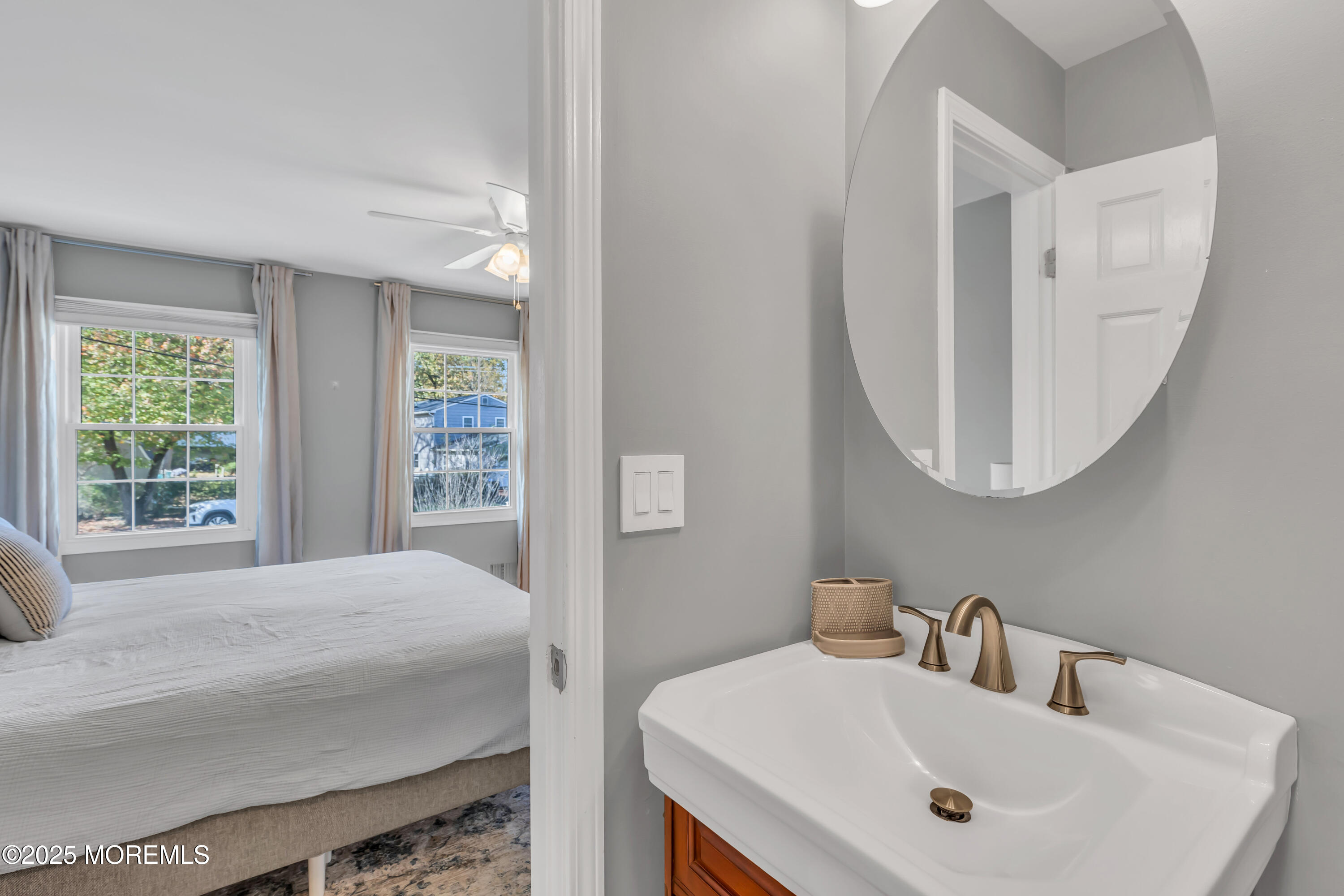 8 Allston Street Red Bank, NJ 07701 - Photo 46 of 64 a bedroom with a sink and a mirror
