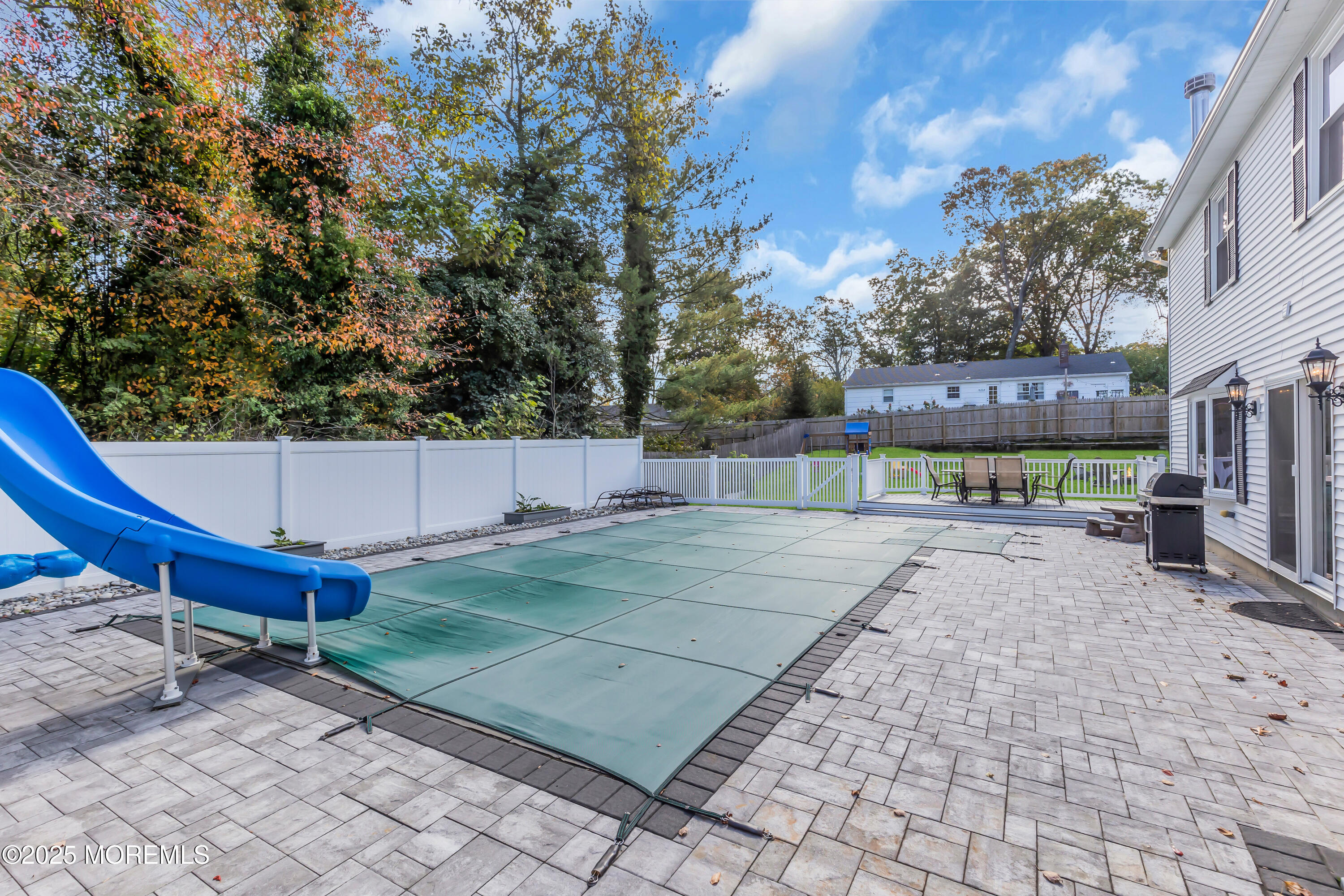 8 Allston Street Red Bank, NJ 07701 - Photo 58 of 64 a backyard of a house with table and chairs