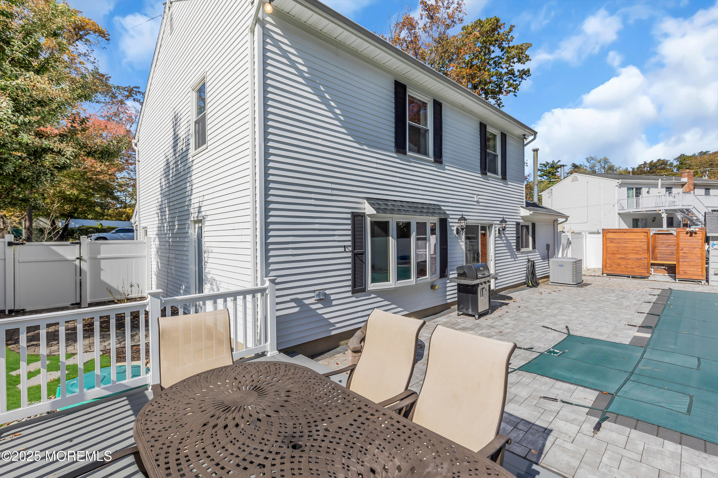 8 Allston Street Red Bank, NJ 07701 - Photo 62 of 64 a view of a patio with couches table and chairs and potted plants