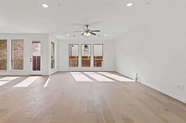 a view of kitchen with windows and ceiling fan