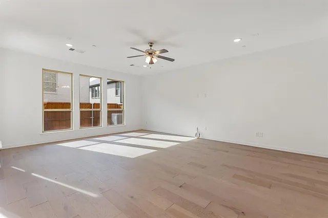a view of a kitchen with granite countertop cabinets and stainless steel appliances