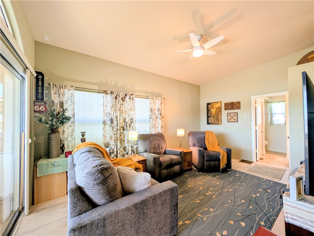 2000 Ramar Road, Unit 308 Bullhead City, AZ 86442 - Photo 23 of 27 Living area with ceiling fan and light wood-style flooring