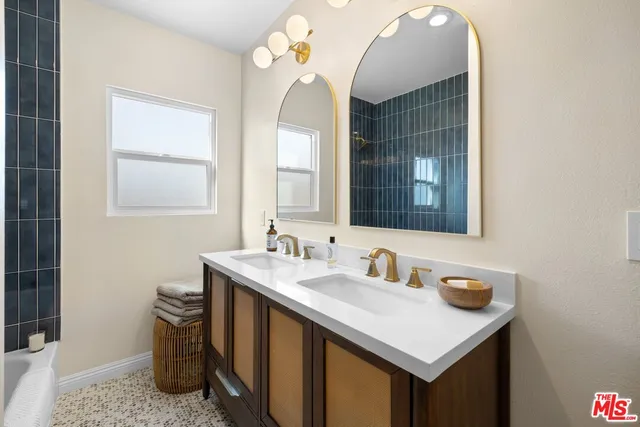 a bedroom with a bed and a night stand