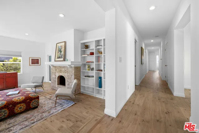 a bedroom with furniture and a fireplace