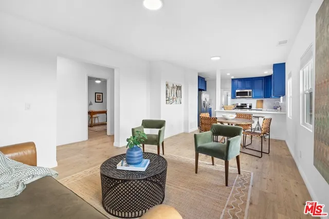 a kitchen with stainless steel appliances granite countertop wooden cabinets sink stove and granite counter top