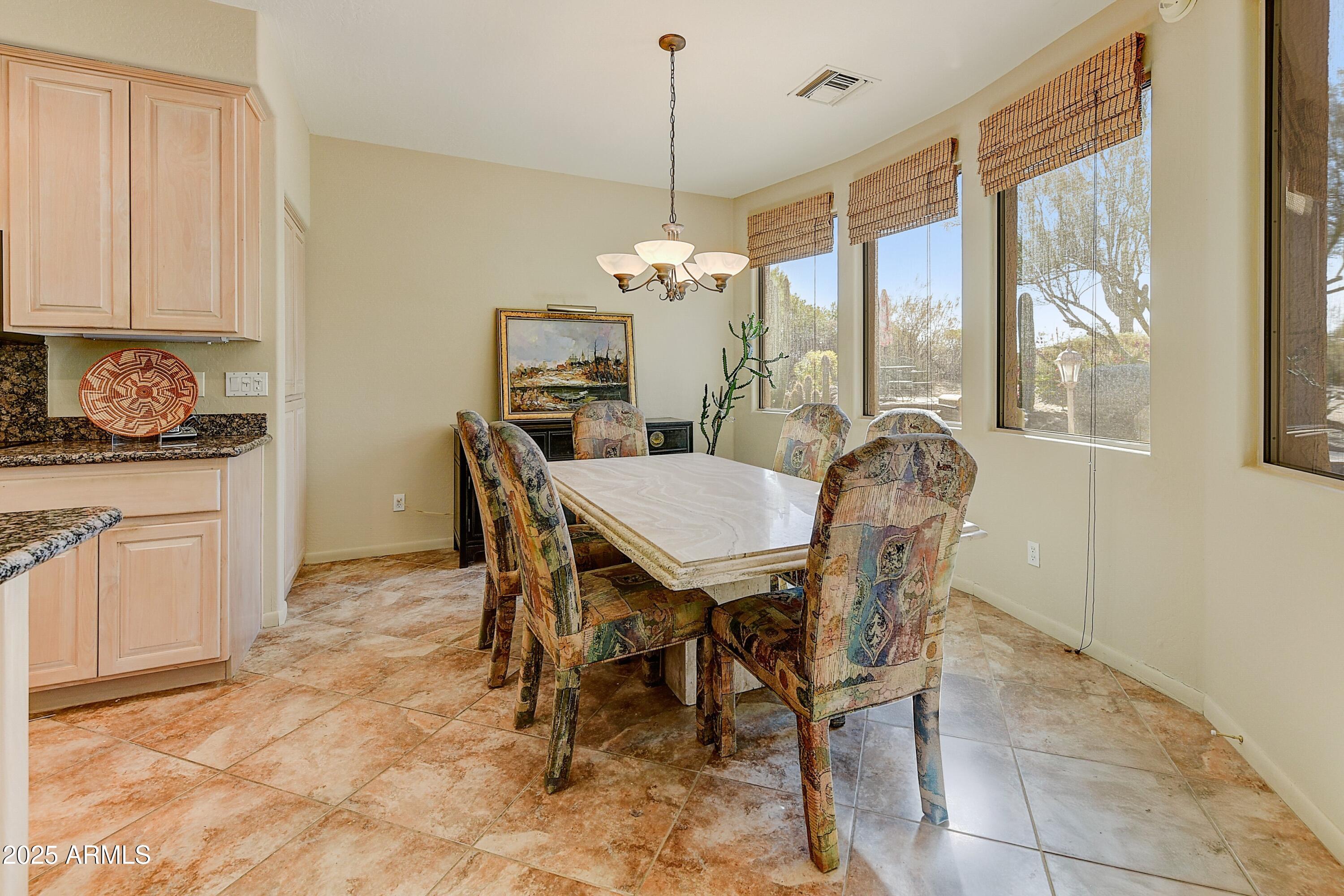 27502 North Azatlan Drive Rio Verde, AZ 85263 - Photo 11 of 21 a view of a dining room with furniture window and outside view