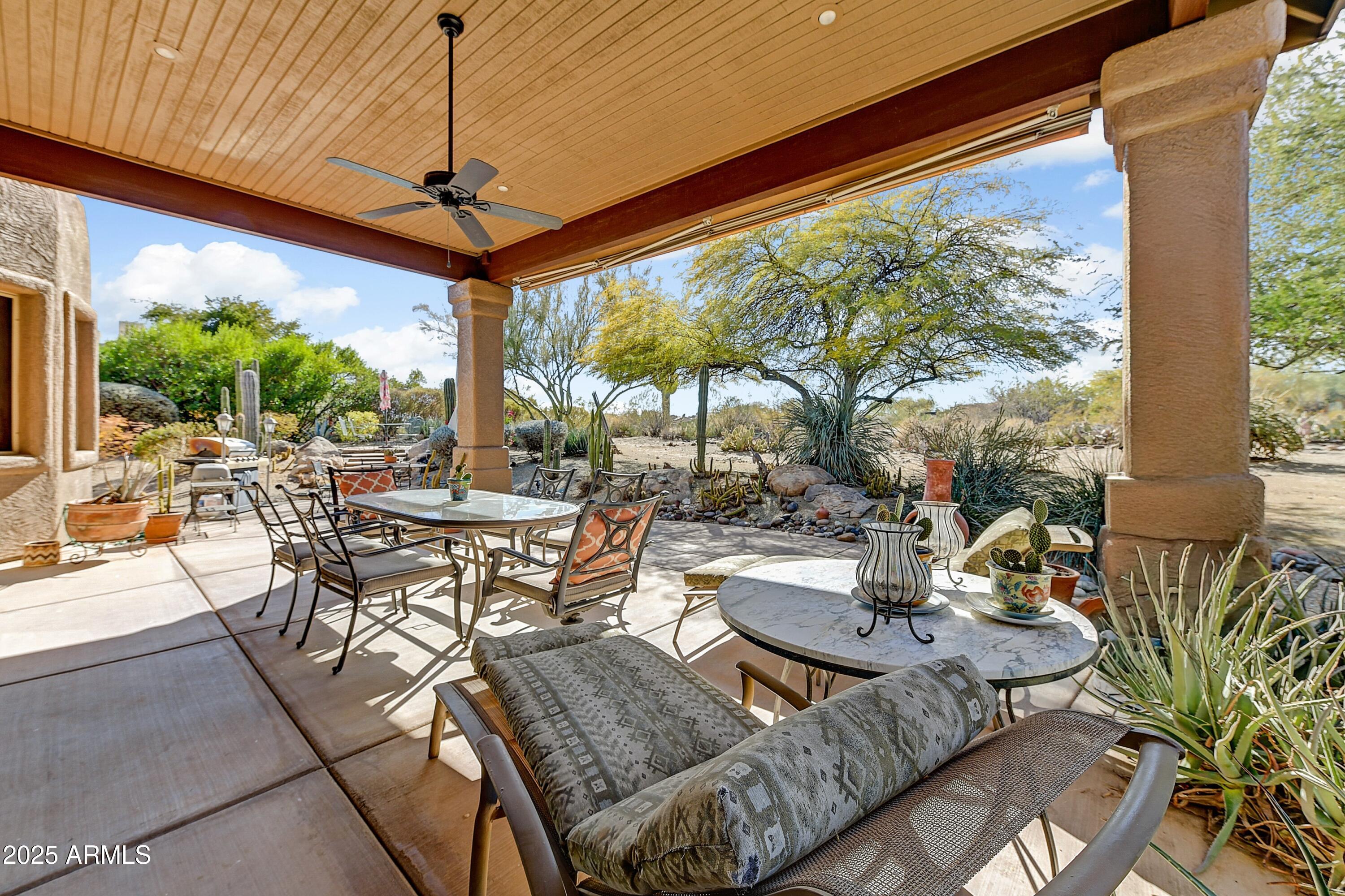 27502 North Azatlan Drive Rio Verde, AZ 85263 - Photo 15 of 21 a outdoor space with a large window and dining table