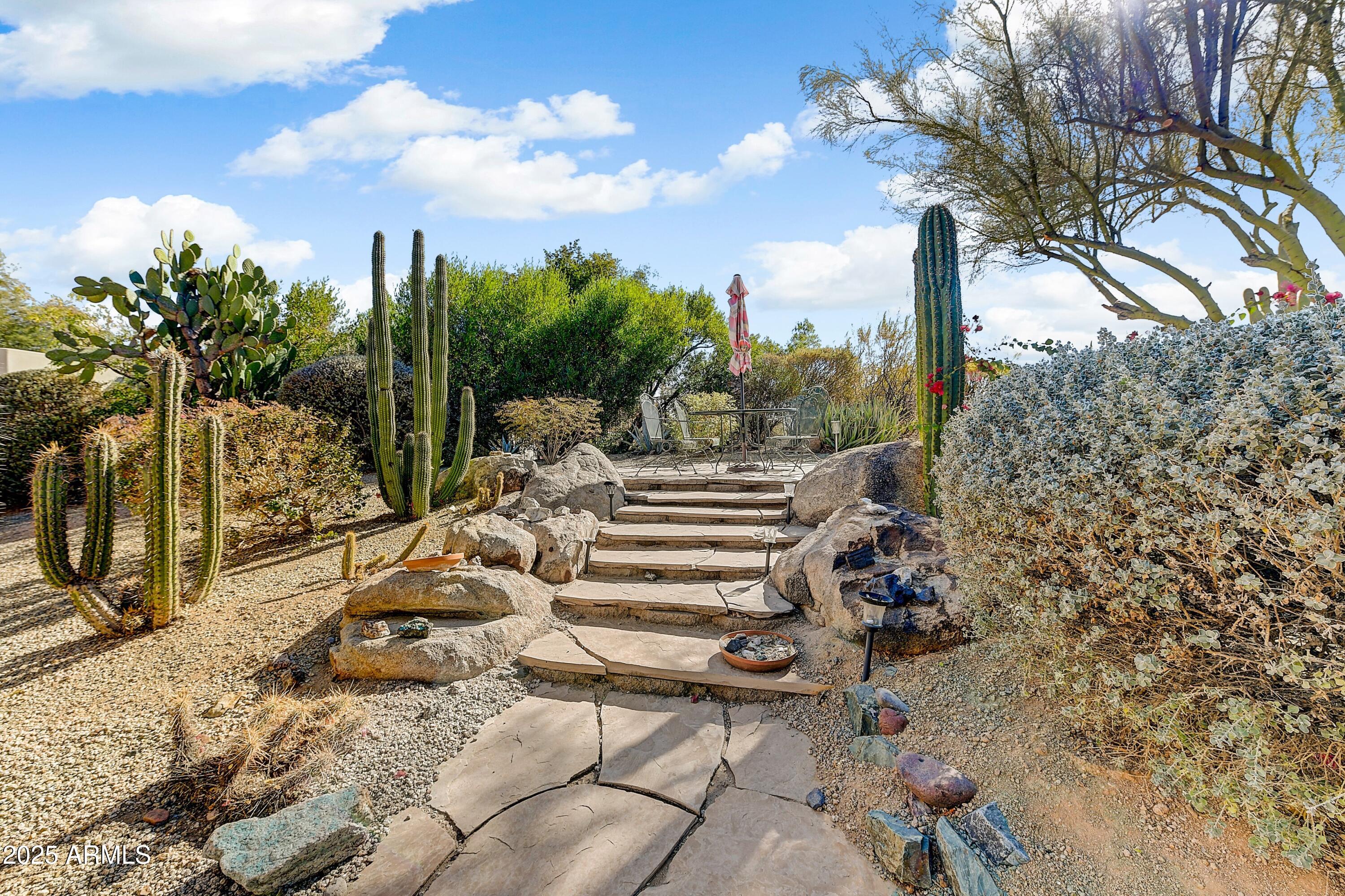 27502 North Azatlan Drive Rio Verde, AZ 85263 - Photo 16 of 21 a view of a patio with iron fence
