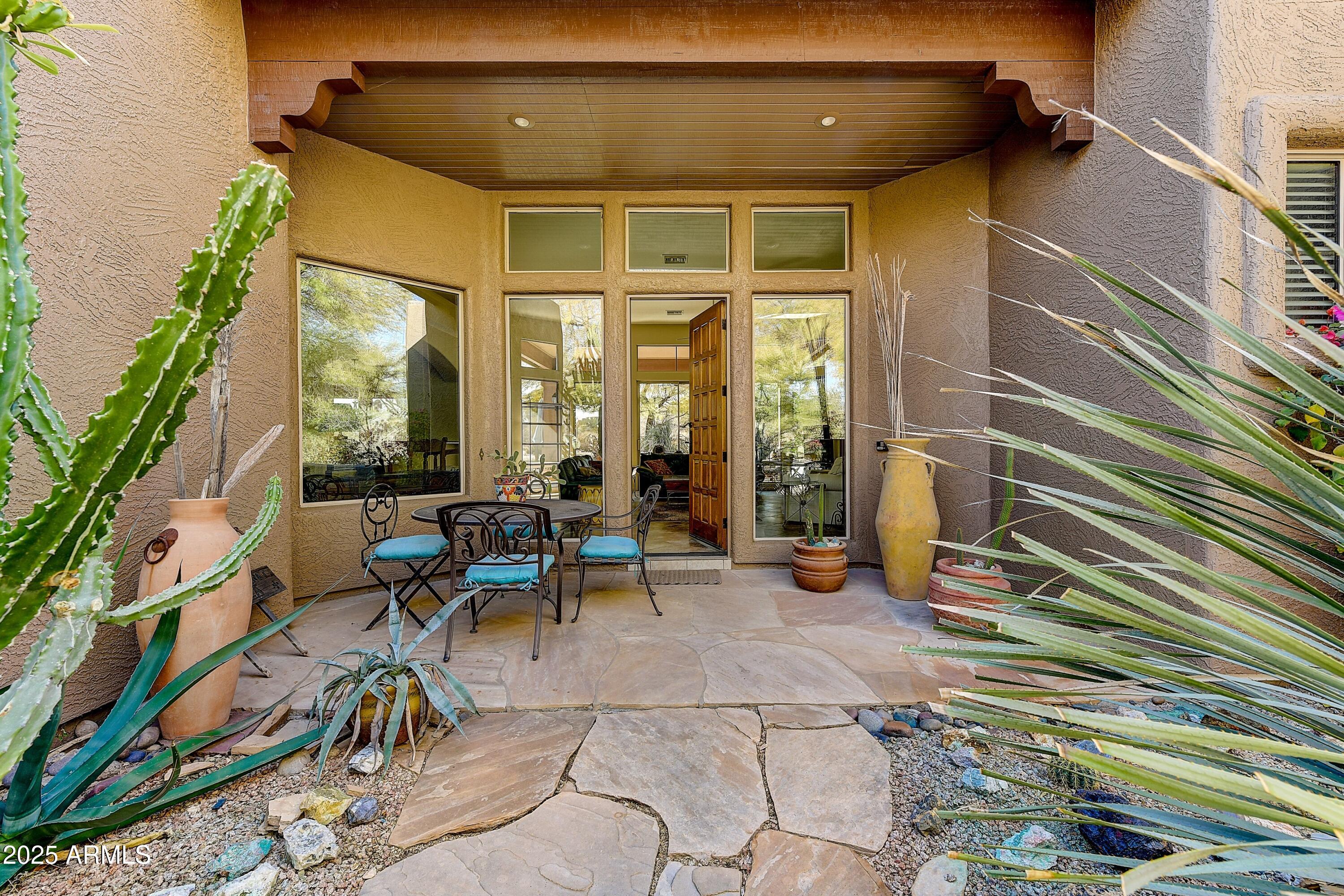 27502 North Azatlan Drive Rio Verde, AZ 85263 - Photo 2 of 21 a view of steet with a chairs and table in a patio