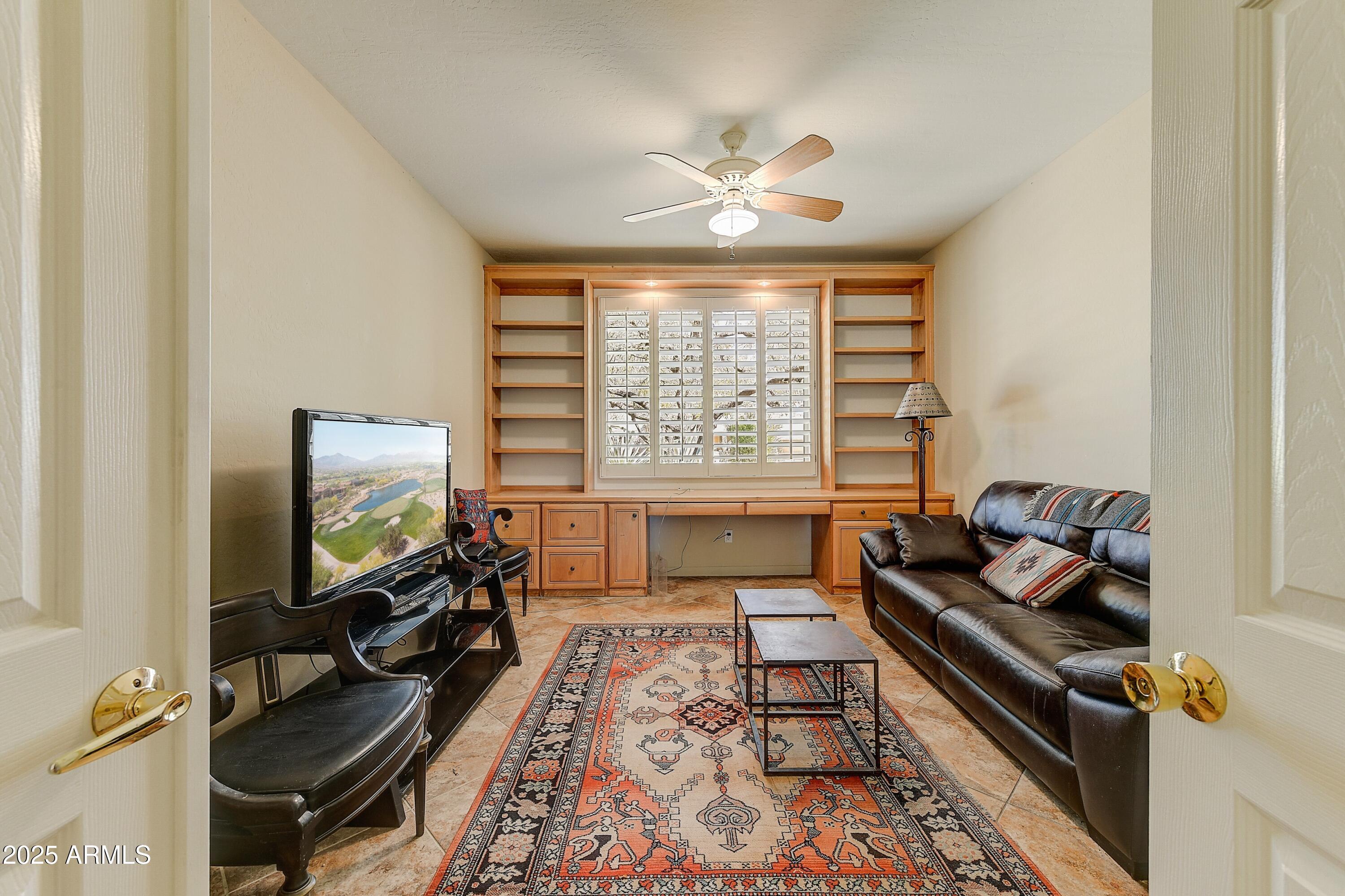 27502 North Azatlan Drive Rio Verde, AZ 85263 - Photo 6 of 21 a living room with furniture and a flat screen tv
