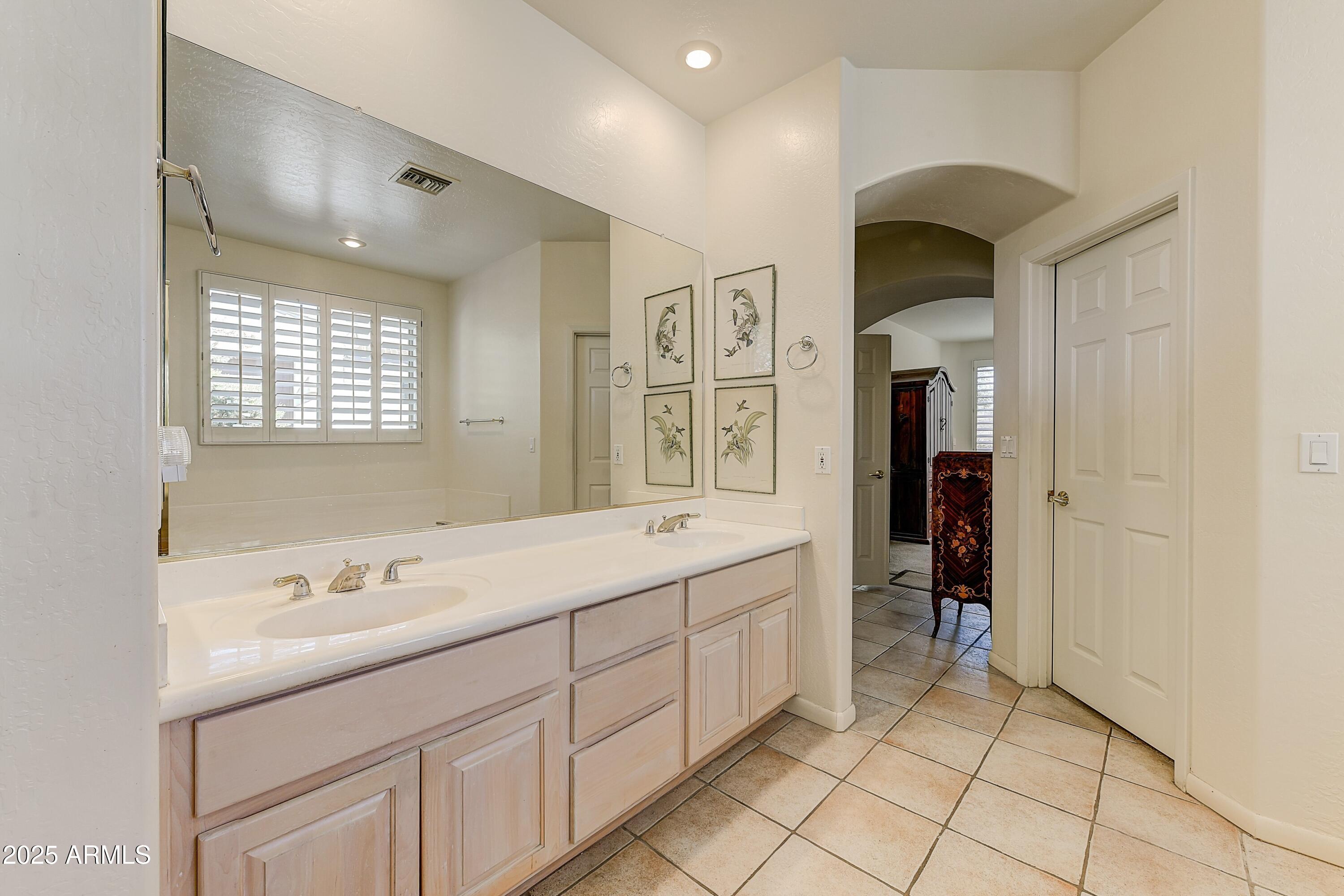 27502 North Azatlan Drive Rio Verde, AZ 85263 - Photo 10 of 21 a spacious bathroom with a shower sink and mirror
