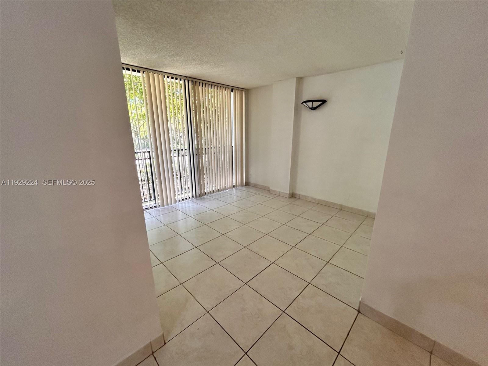 16919 North Bay Road, Unit 214 Sunny Isles Beach, FL 33160 - Photo 19 of 42 a view of an empty room and window