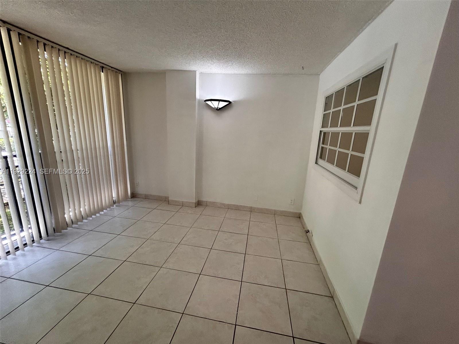 16919 North Bay Road, Unit 214 Sunny Isles Beach, FL 33160 - Photo 20 of 42 an empty room with windows