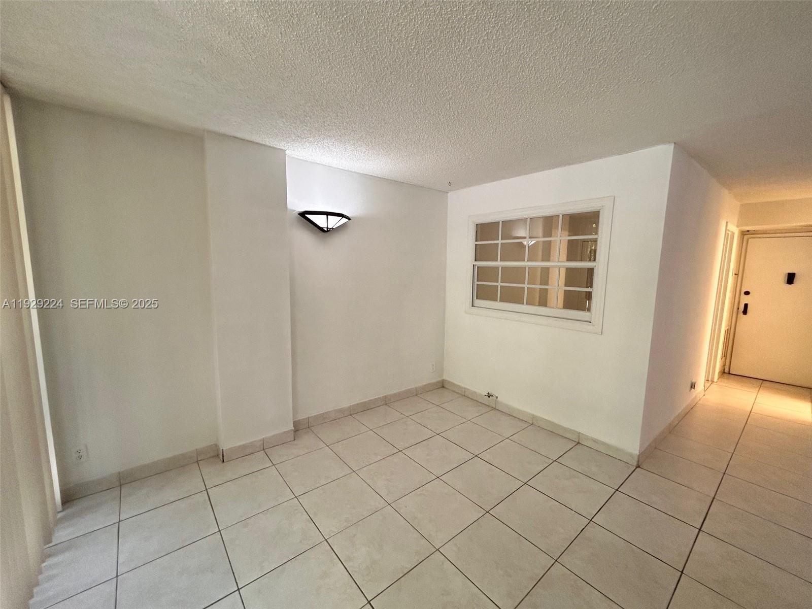 16919 North Bay Road, Unit 214 Sunny Isles Beach, FL 33160 - Photo 21 of 42 an empty room with windows