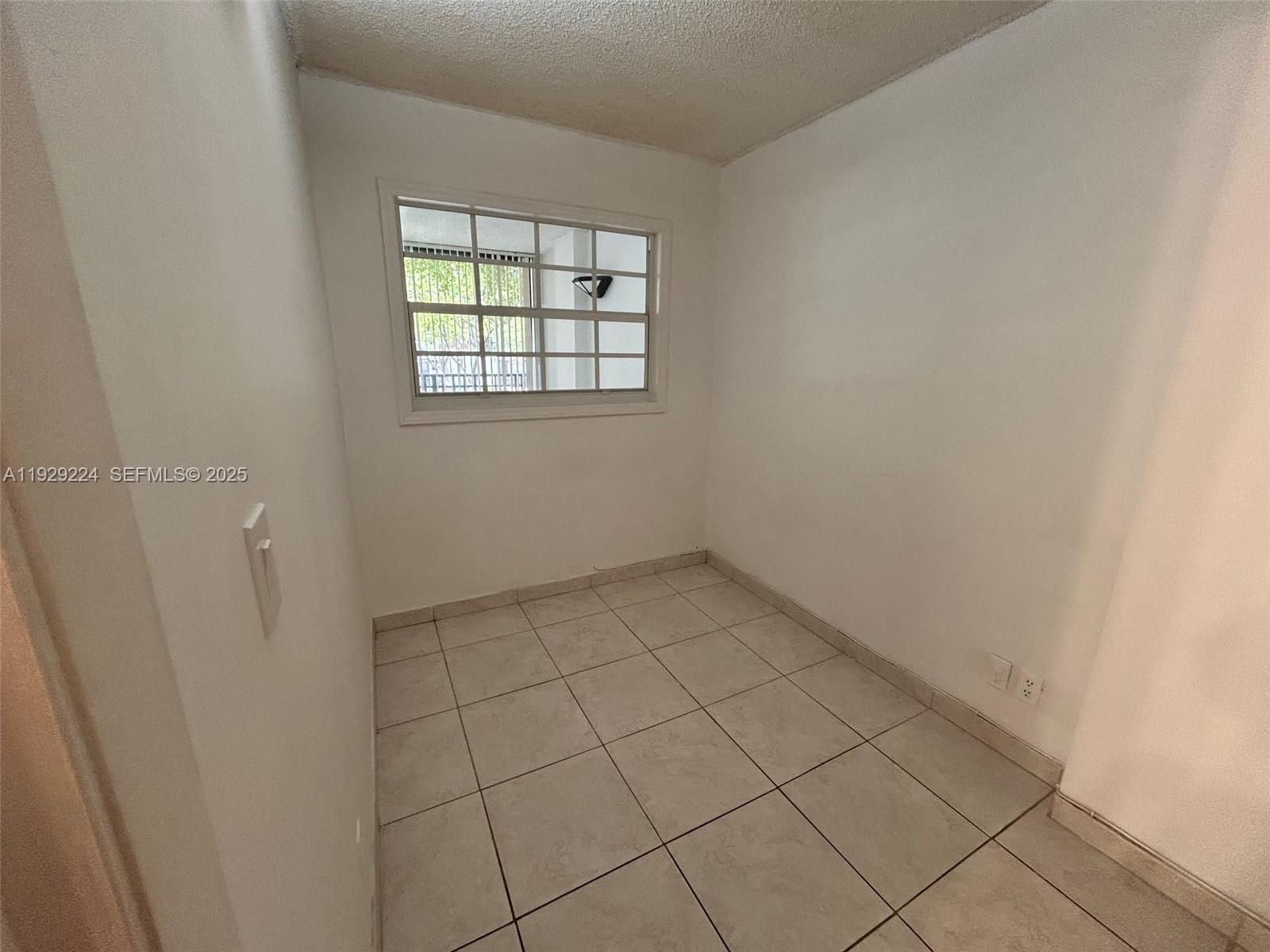 16919 North Bay Road, Unit 214 Sunny Isles Beach, FL 33160 - Photo 22 of 42 an empty room with windows