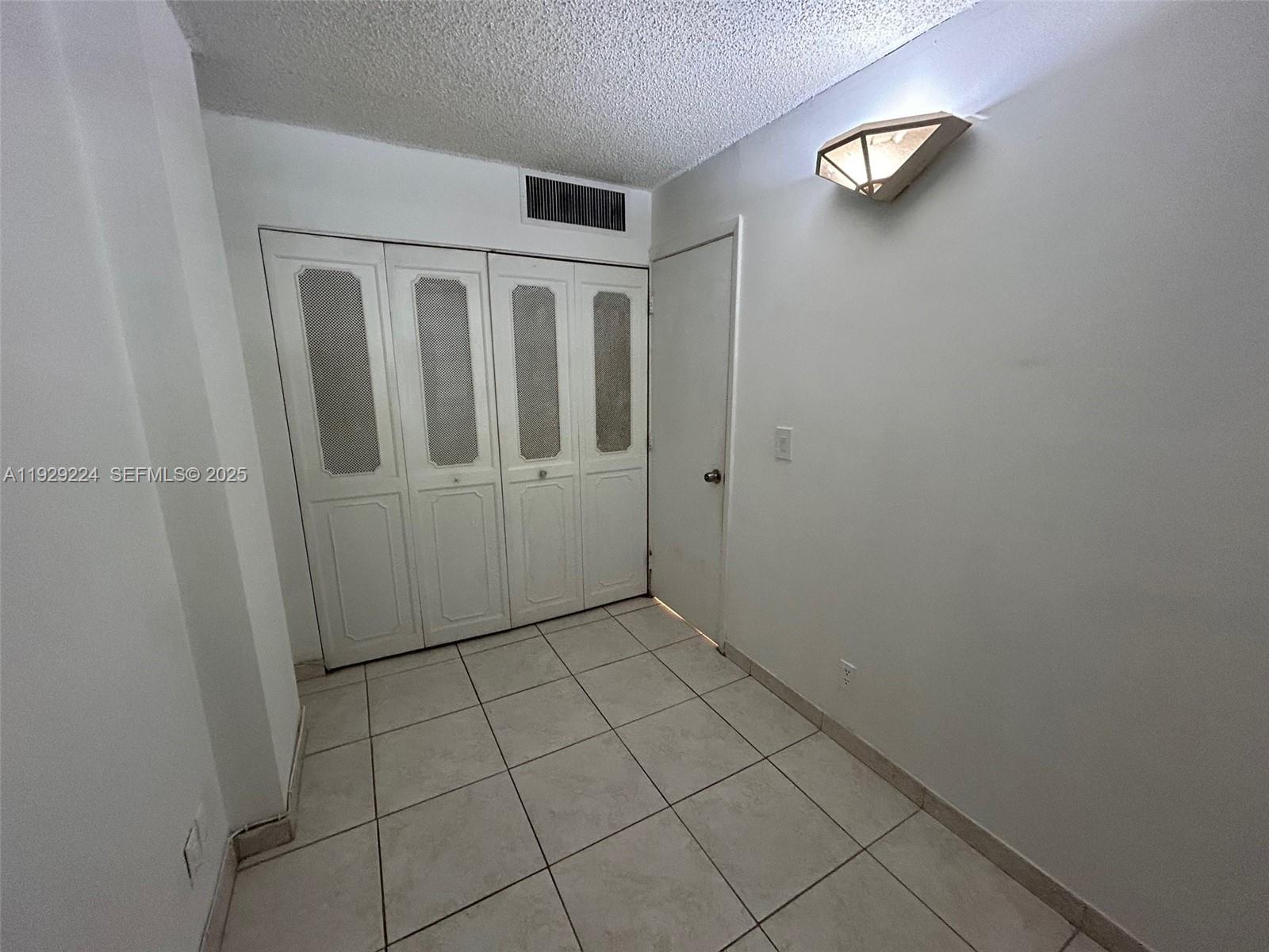 16919 North Bay Road, Unit 214 Sunny Isles Beach, FL 33160 - Photo 23 of 42 an empty room with windows