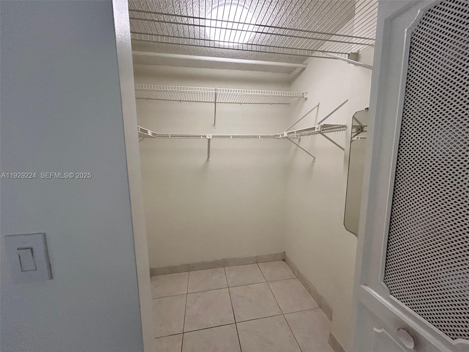 16919 North Bay Road, Unit 214 Sunny Isles Beach, FL 33160 - Photo 28 of 42 a view of a room with racks on the wall