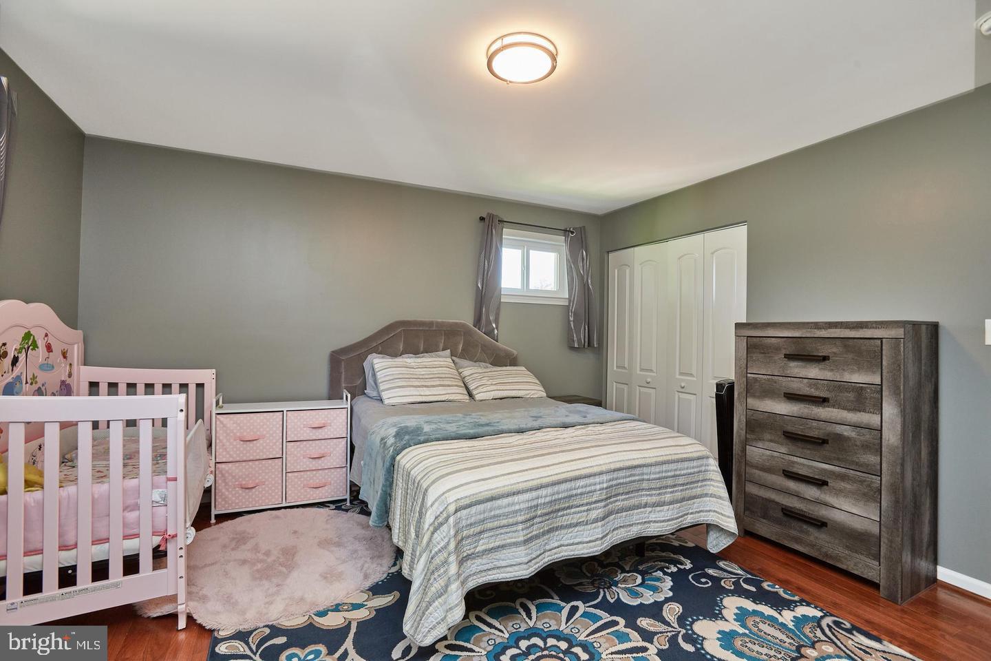 1007 Venice Drive Silver Spring, MD 20904 - Photo 17 of 39 a bedroom with a bed and chair