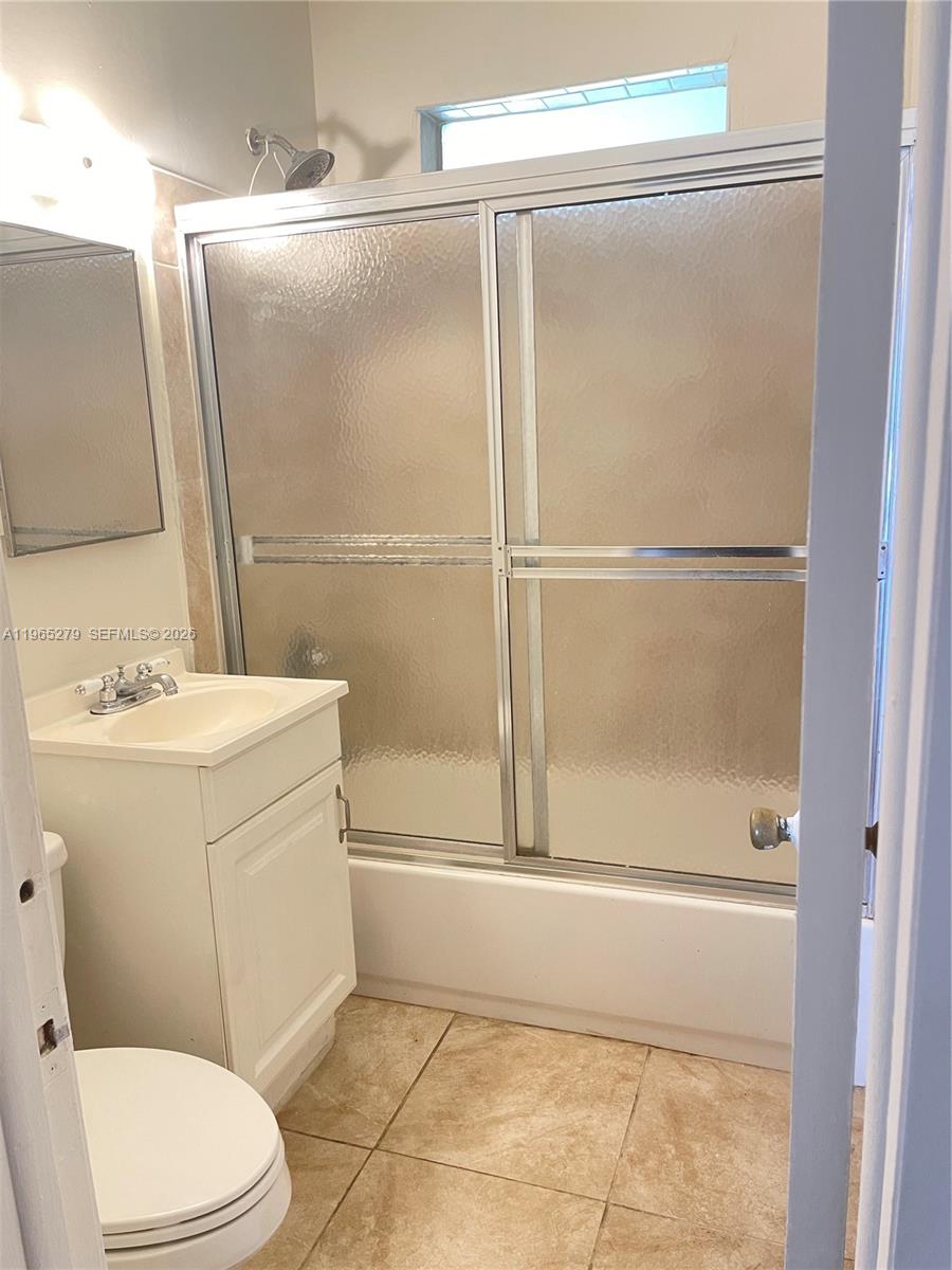 1913 Harding Street Hollywood, FL 33020 - Photo 5 of 9 a bathroom with a sink a toilet and shower