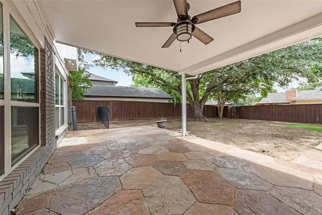 a view of a porch with a fireplace and a large window