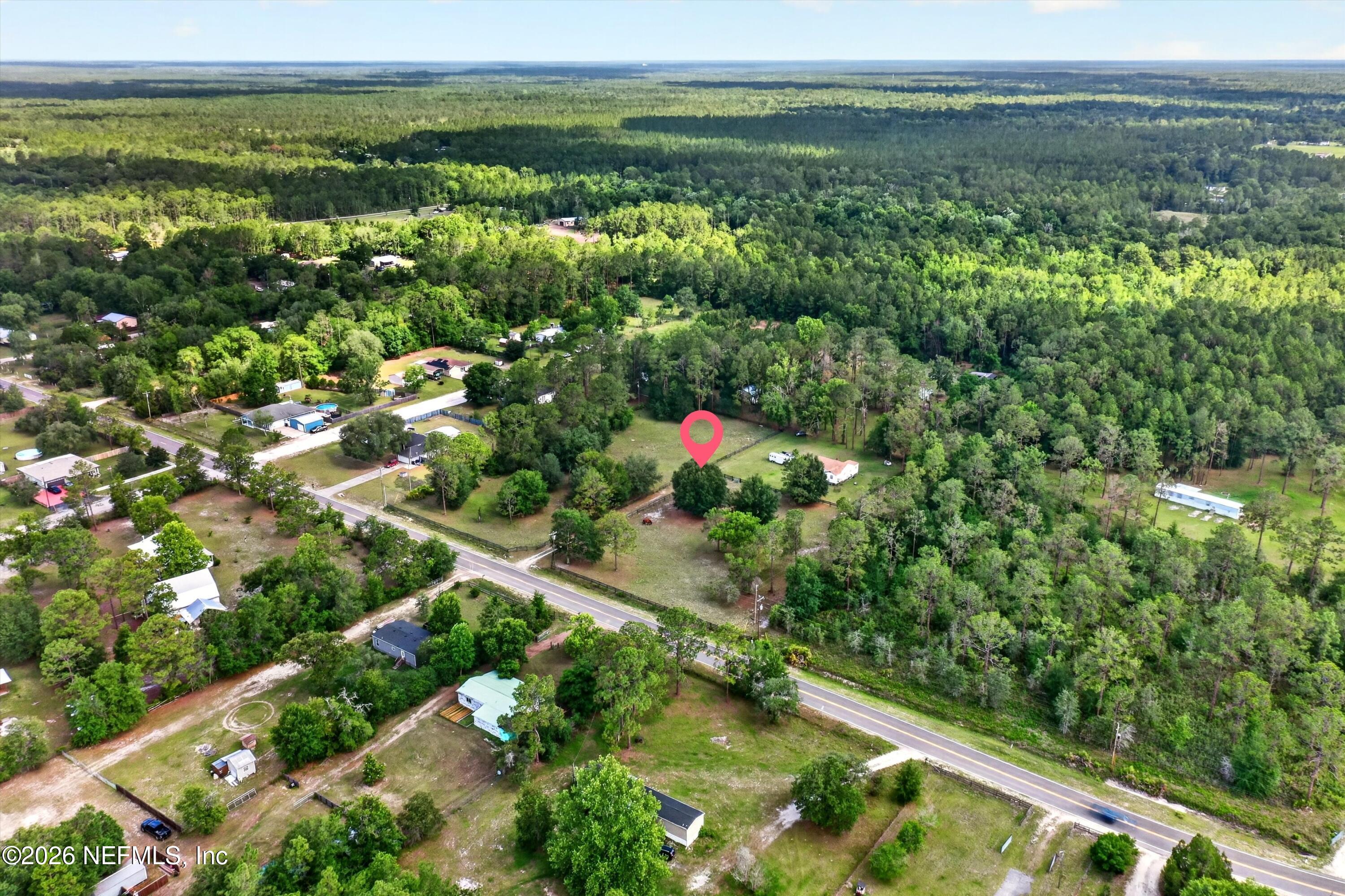 5214 Carter Spencer Road Middleburg, FL 32068 - Photo 50 of 50 an aerial view of residential houses with outdoor space and trees