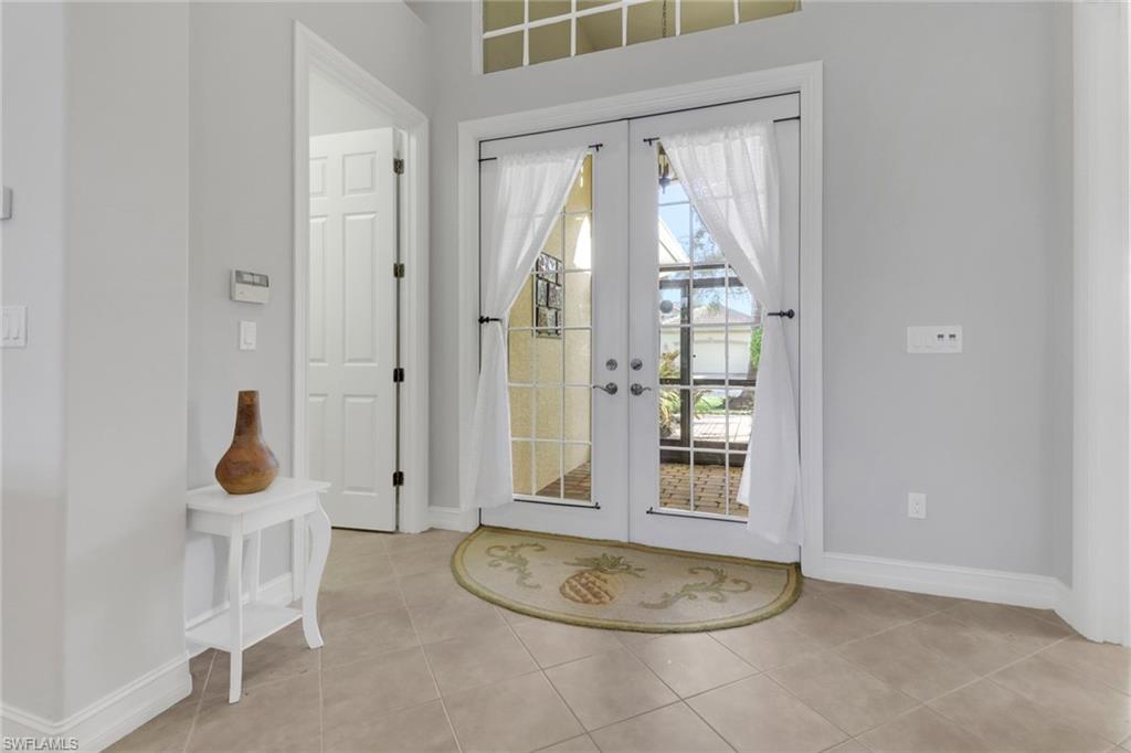 6757 Bent Grass Drive Naples, FL 34113 - Photo 3 of 27 a bathroom with a sink toilet and shower