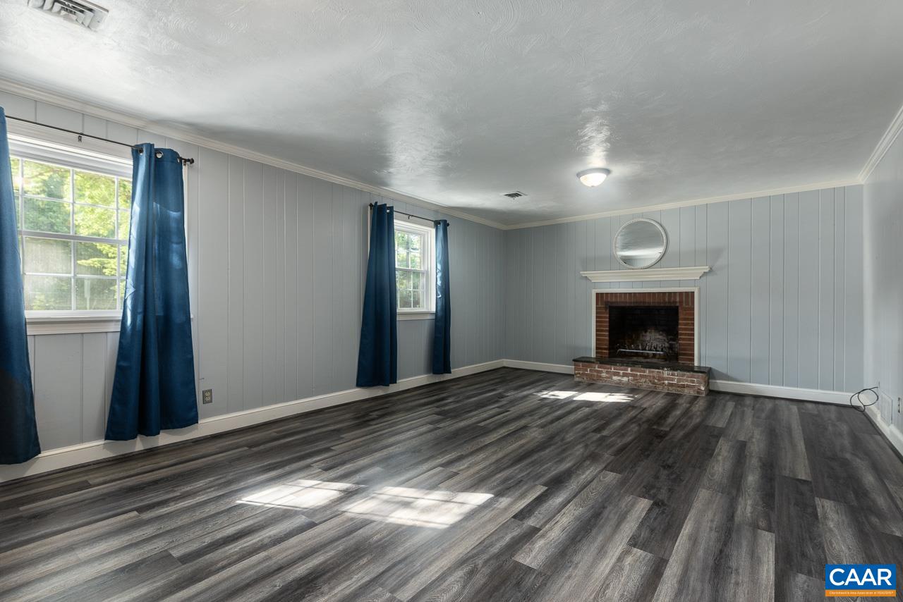 101 Westminster Road Charlottesville, VA 22901 - Photo 13 of 25 a view of an empty room with wooden floor and a window