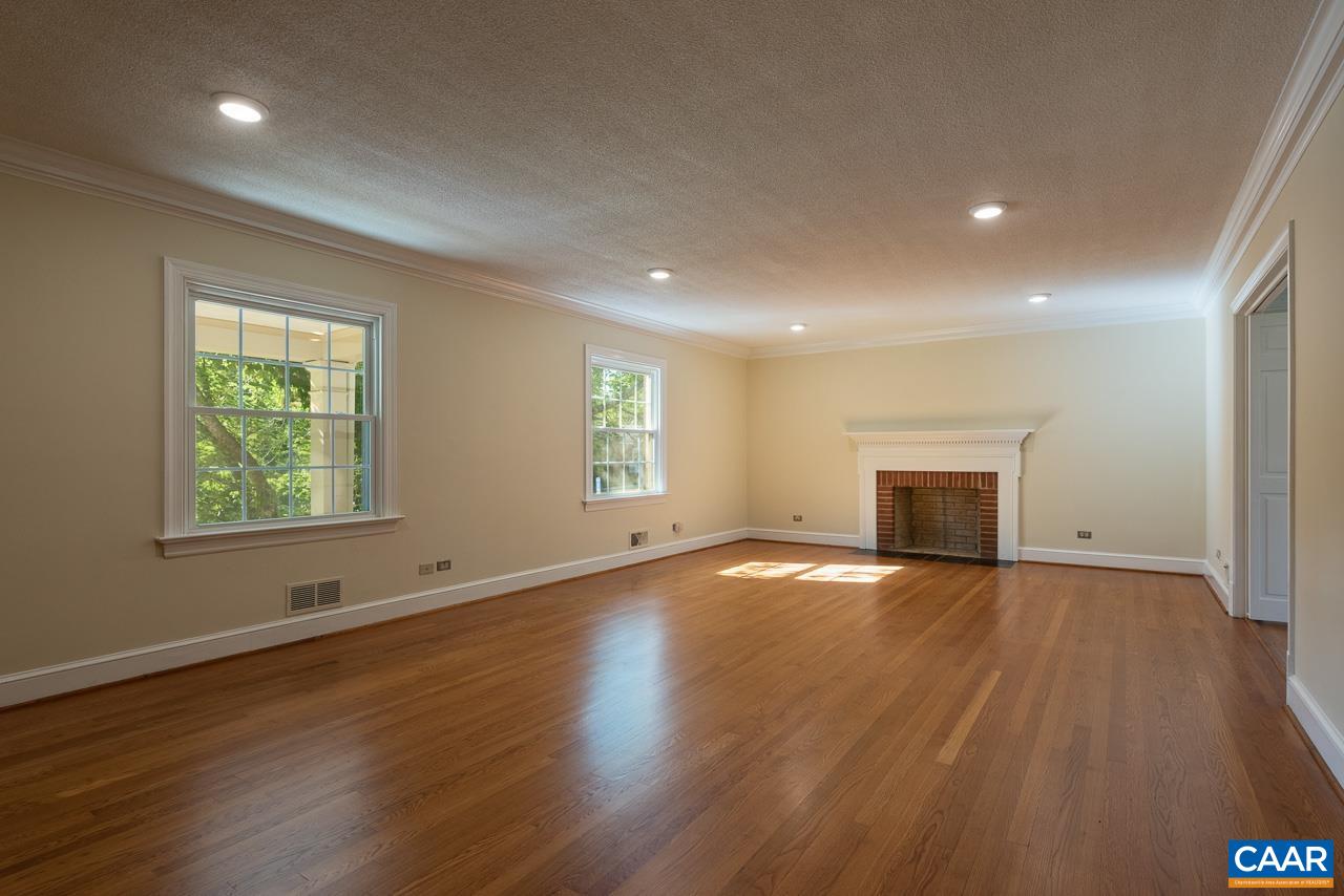 101 Westminster Road Charlottesville, VA 22901 - Photo 3 of 25 an empty room with wooden floor and windows