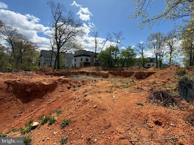 a view of a street with a yard