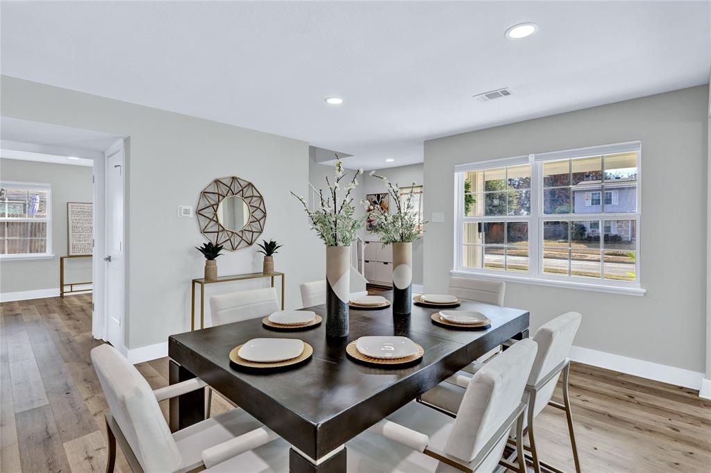 8635 Strathmore Drive Dallas, TX 75238 - Photo 11 of 35 a view of a dining room with furniture and wooden floor